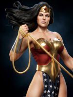 Wonder Woman in gold armor brandishing her Lasso of Truth against a dark backdrop, hair flowing, confident pose.