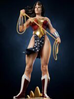 Wonder Woman action figure standing on a pedestal, gripping the Lasso of Truth with star-spangled sash and red-gold armor.