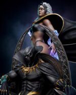 Silver‑haired female superhero in dark armor and cape, standing beside a circular rune‑patterned shield with a black armored foe nearby.