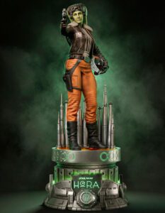 Hera Syndulla Star Wars action figure standing on a futuristic pedestal with a green glow and tall silver spires, holding a blaster.